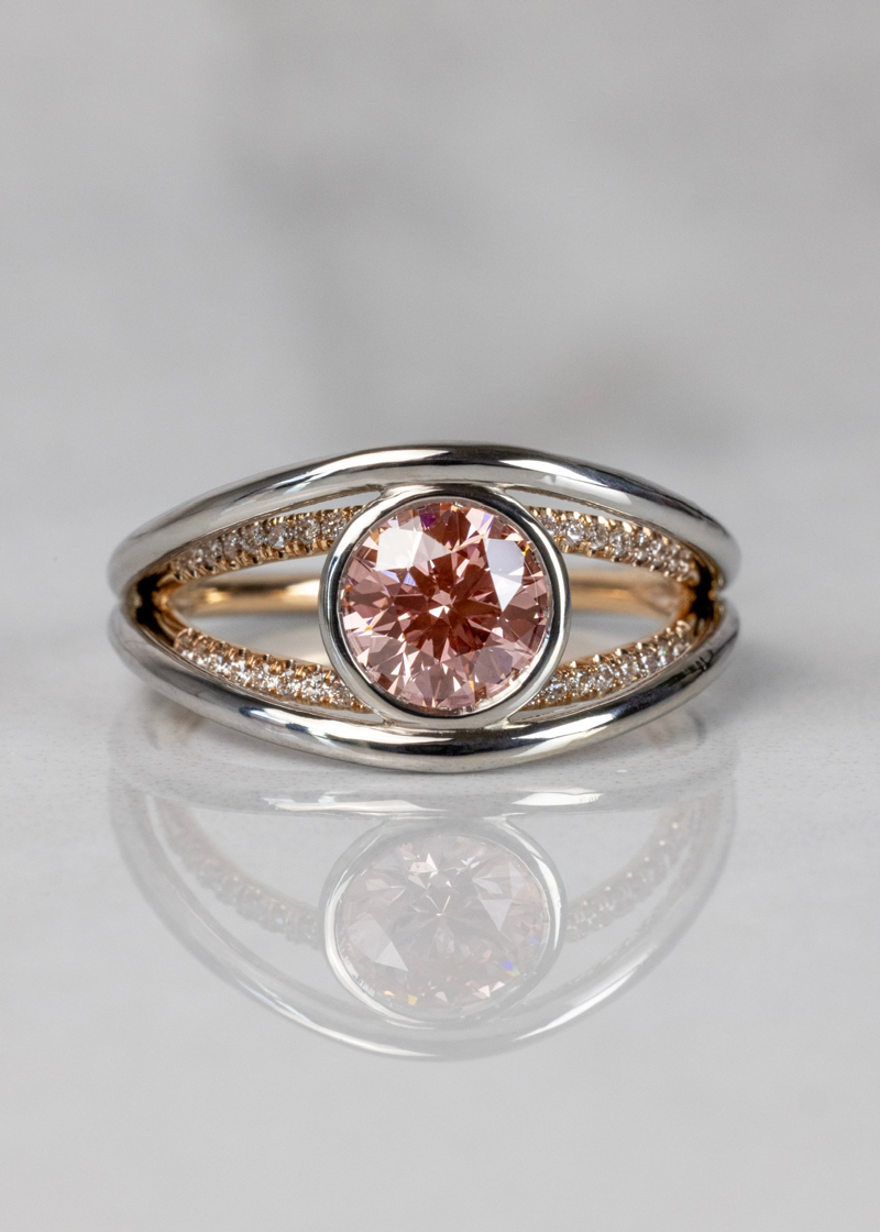 Split shank engagement ring with bezel set fancy color diamond