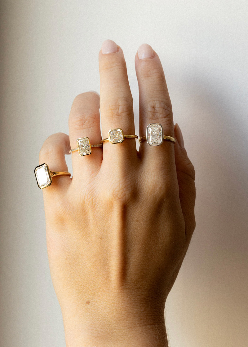 An assortment of bezel set diamond rings