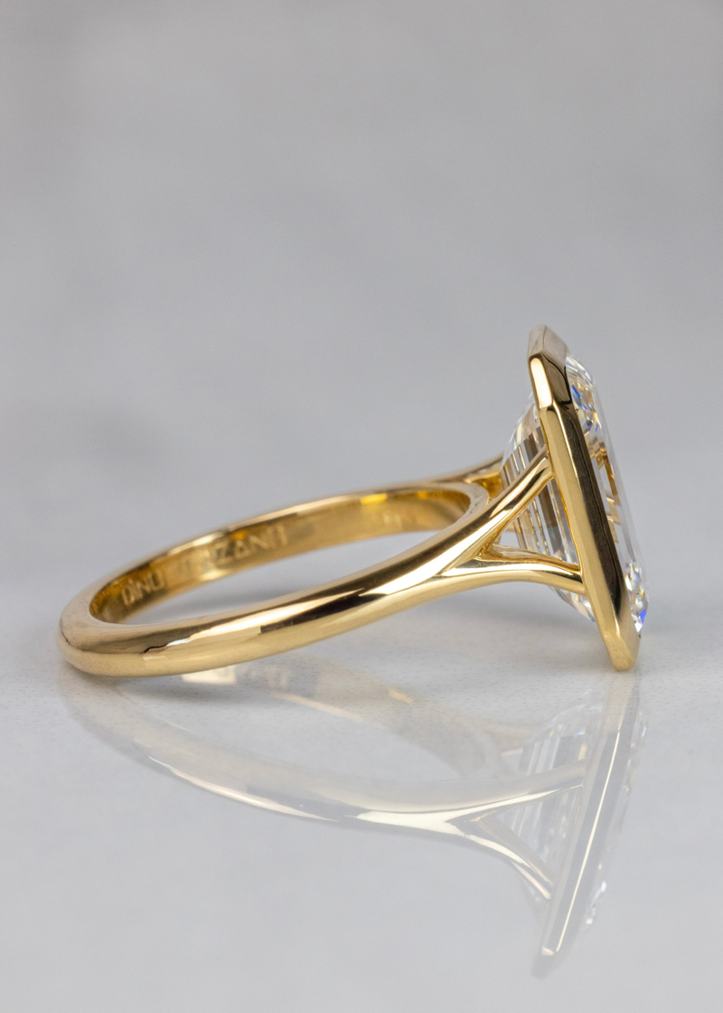 Diamond Bezel-set engagment ring with emerald-cut diamond