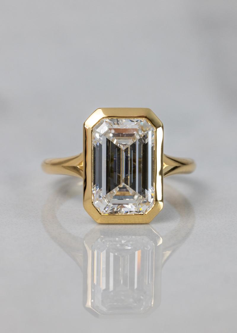 Diamond Bezel-set engagment ring with emerald-cut diamond