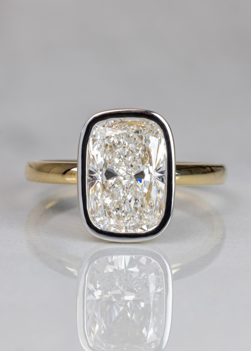 Radiant diamond bezel-set in solitaire engagement ring